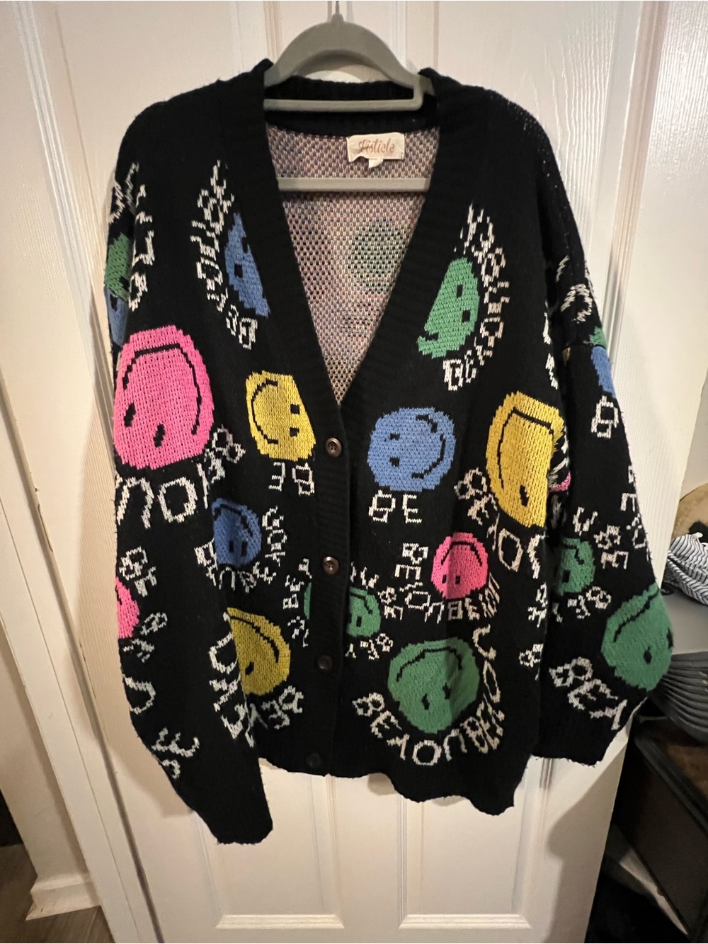 Listicle Black Cardigan with Pink, Yellow, Blue and Green Smiley Motifs